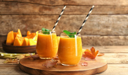Two,Glasses,With,Pumpkin,Smoothie,On,Wooden,Board